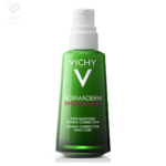 VICHY Normaderm Phytosolution dnevna krema s dvostrukim učinkom protiv nepravilnosti i akni u zelenoj bočici sa pumpicom.
